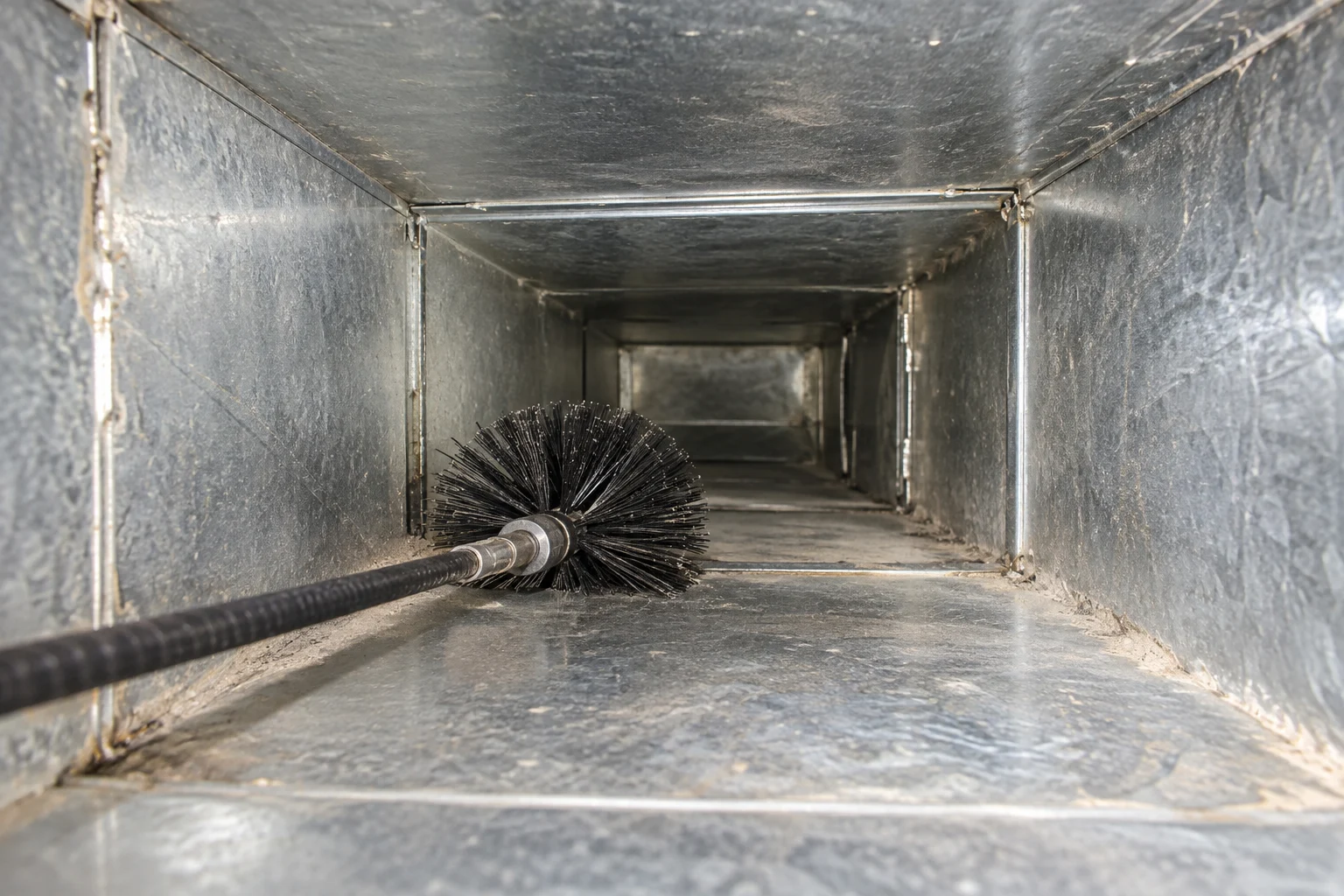 Rotary brush in a metal air duct
